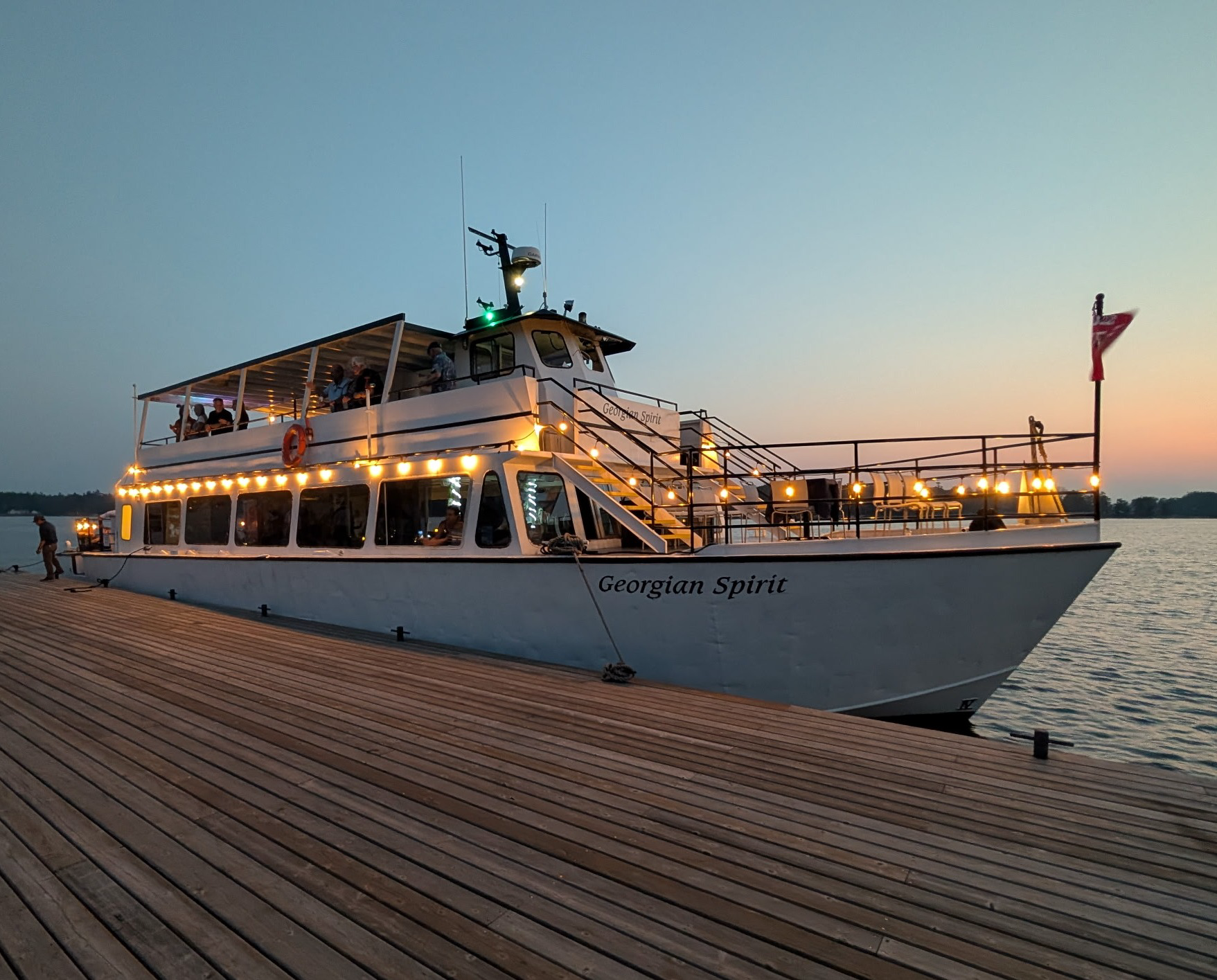 Guests seated at tables during dining cruises while the vessel sails through Georgian Bay.